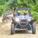Two UTVs driving on a dirt road